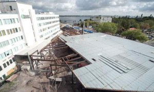 Roofing is going on the building.