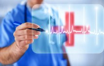 Doctor drawing over a heart beat transposed over the image